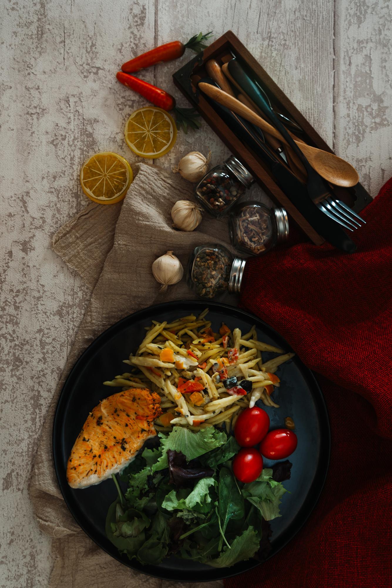 Large editorial shot of plated meal on dark table